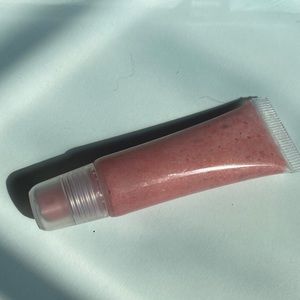 Super glittery, pink, handmade lipstick. It will make your lips sparkly